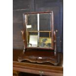 A Victorian mahogany swing dressing mirror of traditional design. 60CM.