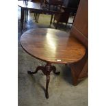 A George III mahogany snap top stem table, raised on a balluster turned stem and three downswept