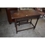 A Victorian oak foldover card table with swivel action and nulled frieze over turned supports, 76CM.