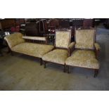 A late Victorian mahogany three piece lounge suite, comprising chaise longue and his and hers