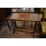 A Victorian mahogany side table. of canted rectangular form with turned support, linked by a plain
