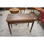 A George III mahogany fold over tea table, with gated supports to rear and single drawer to