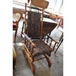 A Victorian turned satin wood American style rocking chair. Seat 38CM.