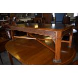 A Reproduction elm and mahogany rectangular coffee table, the canted top with quarter veneered