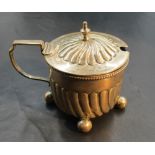 A Victorian silver mustard, of circular form with spiral gadrooning to the domed cover and body,