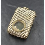 An early 20th century silver-plated vesta case, of traditional form with fluted decoration and