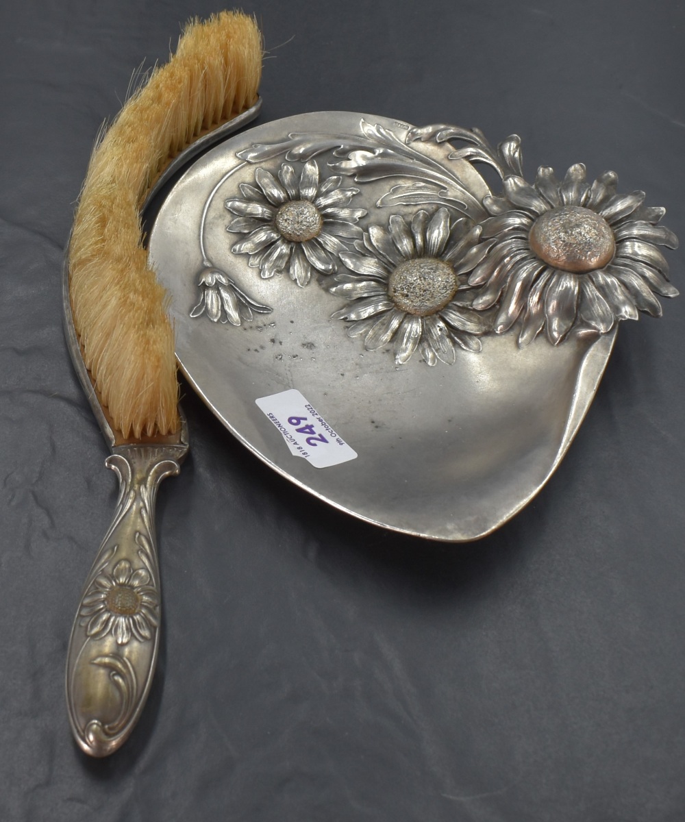 A WMF Art Nouveau/Jugendstil crumb brush and tray, moulded in high relief with Helenium blossoms,