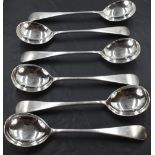 A set of six Edwardian silver Old English pattern soup spoons, each with pip reverse and engraved