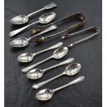 A selection of mixed silver spoons and sugar tongs, varying styles, dates and makers, gross weight