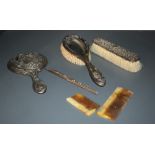 A group of three silver mounted dressing table wares, comprising hand mirror, hair brush, clothes
