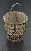 A continental white metal sugar basket, with twisted over handle over the tapering cylindrical