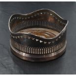 A silver plated wine coaster, of traditional form with turned oak interior, 12.5cm
