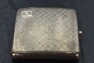 A 1920's silver cigarette case, of hinged rectangular form and curved for the gentleman's pocket,