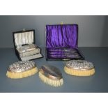 A 1940's cased silver backed clothes brush and comb set, each with engine-turned decoration, marks