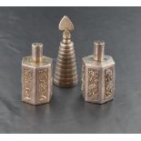 A near pair of Chinese silver coloured white metal pepperettes, having cylindrical pierced pull-