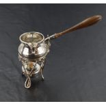 A Victorian silver toddy ladle and warming stand, the baluster ladle body with angular spout,