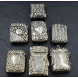 An unusual silver plated vesta case, embossed with C-scrolls enclosing a game hunting scene,