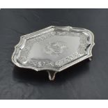 A George III silver visiting card tray, of shaped rectangular outline, the moulded rim enclosing a