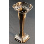 A 1920's silver spill vase, of tapering square section form with shaped and pierced rim, the base