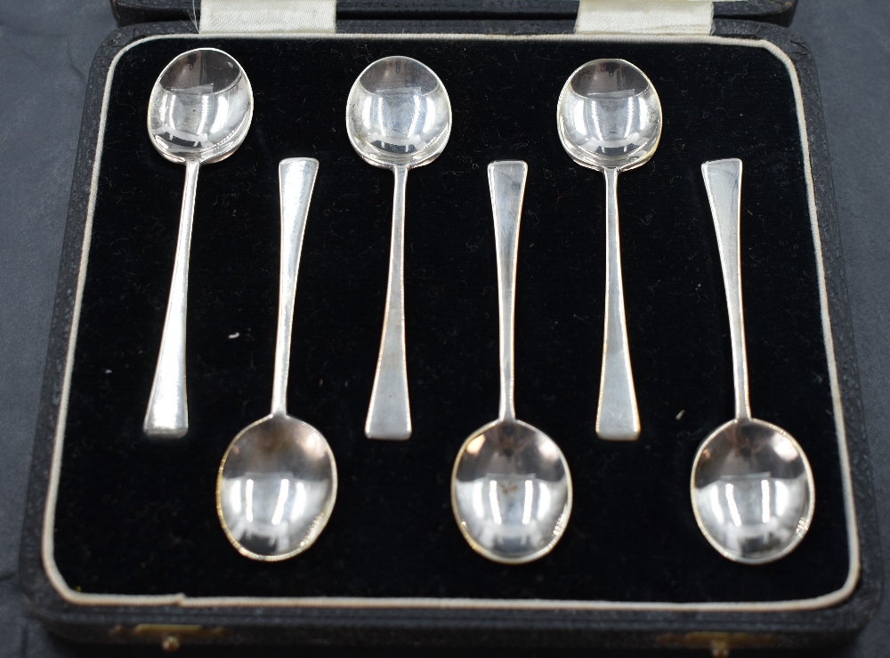 A cased set of six 1930's silver coffee spoons, with ovoid bowls and plain tapering stems, marks for