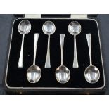 A cased set of six 1930's silver coffee spoons, with ovoid bowls and plain tapering stems, marks for