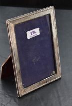 An imported silver mounted photograph frame, of rectangular form, with bead moulded and finely