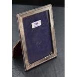 An imported silver mounted photograph frame, of rectangular form, with bead moulded and finely