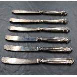 A set of six silver handled dessert knives having moulded handles, Sheffield 1917, Yates Brothers,