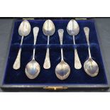A cased set of six Edwardian silver coffee spoons having extensively engraved stems and plain