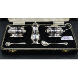 A 1960's cased silver three piece condiment set, of baluster form with re-entrant corners, marks for