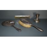 A George V silver mounted three piece brush set, comprising comprising hair brush, hand mirror and