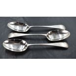 A group of three Edwardian silver Old English pattern table spoons, each with pip reverse and