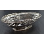 A Georgian silver sweetmeat basket of boat form having pierced and bright cut decoration, beaded