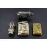 A group of four white and gilt metal vesta cases, to include a pig form vesta, Oriental design
