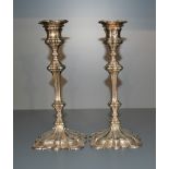 A pair of silver plated candlesticks, of classical design with removable sconces, marked for