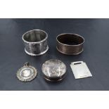 A small group of mixed silver, to include two napkin rings, circular pill box and two medallions,