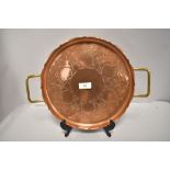 An Arts and Crafts era S&S Sankey copper tray with brass handles and foliage decoration