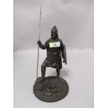 A cast metal Viking warrior figurine, with shield and spear.