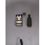 A miniature 1920s Myatt ladies razor and a metal bodied souvenir seal with screw fastening for