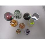 A collection of paperweights including Caithness and millefiori.