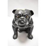 An early 20th century English ceramic figure of a Bull dog seated