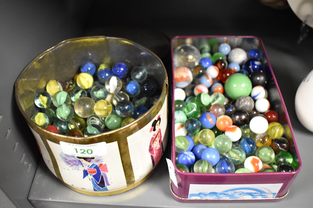 A selection of early 20th century children's toy marbles in various colours and designs