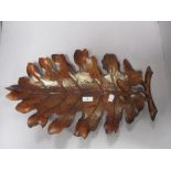 A large wood effect moulded oak leaf, can be used as a table decoration or hang on a wall.