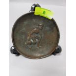 A bronze effect Joseph Walker and co, Birmingham, pin dish, depicting man playing lawn bowls,