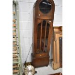 An early 20th Century oak cased long case clock in the Art Deco style