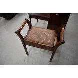 An Edwardian mahogany piano stool