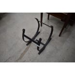 A wrought iron log holder