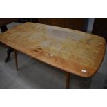 A vintage Ercol style kitchen dining table (af)