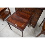 A reproduction shallow hall chest of two over three drawers and a similar occasional table