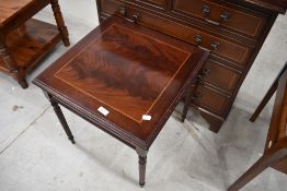 A reproduction shallow hall chest of two over three drawers and a similar occasional table